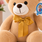 Oso Beige con Moño Dorado